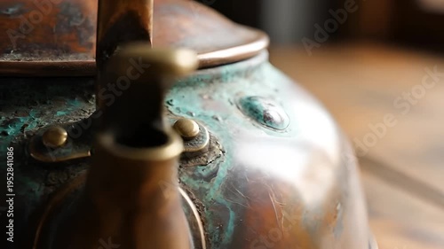 Close-up of an antique copper kettle with patina and verdigris.