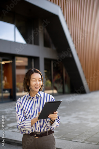 Korean woman uses tablet wh...