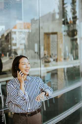 Korean woman talking on the...