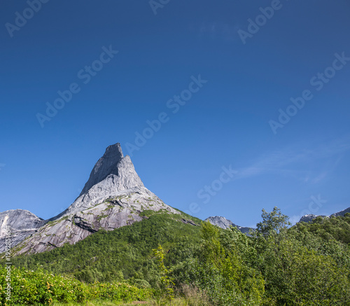 Stetinden Norwegian National Mountain in Nordland with Norwegian national flag
