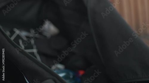 Hand with water supplies in detailed view, Closeup of tattooed hand equipped with water supplies nearby, Detailed closeup showcasing tattooed hand with water supplies ready for use nearby