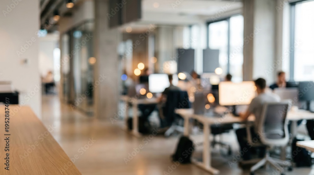 Fototapeta premium Blurred Modern Office Interior with Professionals at Desks