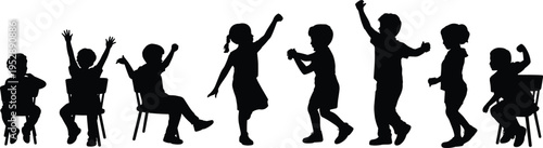 Black silhouette of a group of children playing and sitting on chairs in a classroom representing education and happy childhood