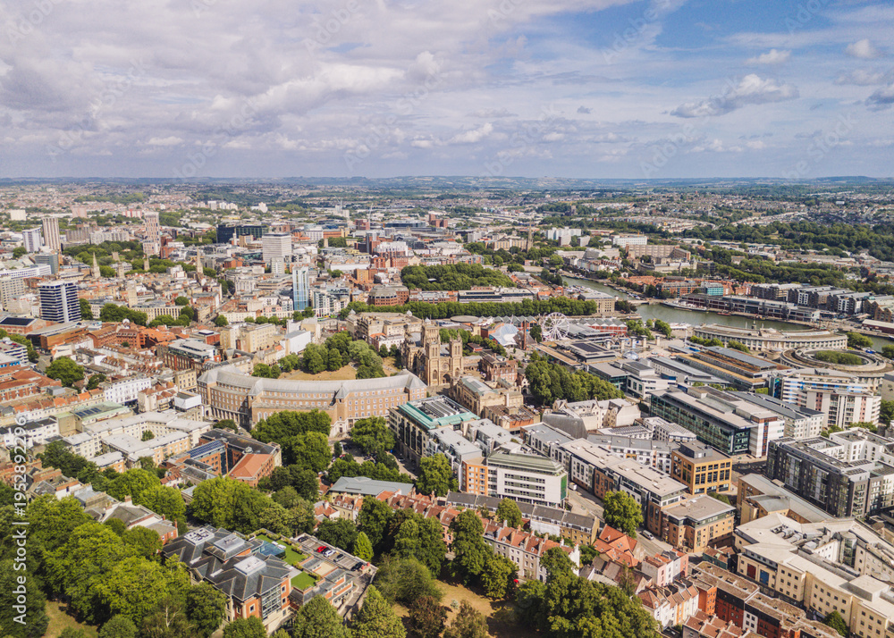 Obraz premium Bristol England: 28th July 2025: Drone view of Bristol Harbourside, surrounded by historic buildings along the River Avon with city in background