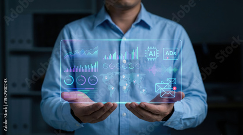 Opened iA person in a blue shirt interacts with an advanced holographic display showing complex digital data visualizations, including charts, graphs, a world map, and artificial intelligence symbols,