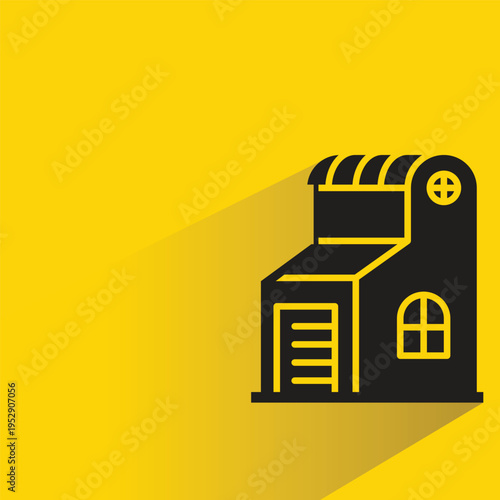 house building icon with shadow on yellow background