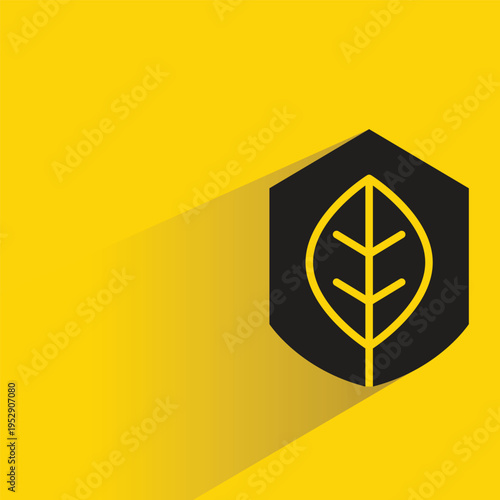 shield with leaf icon with shadow on yellow background