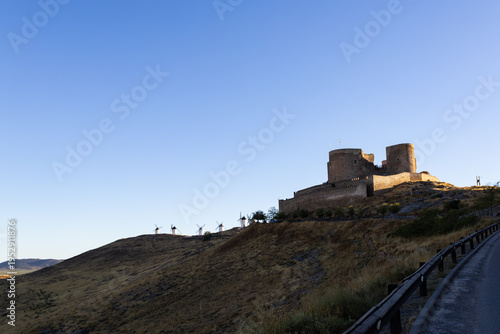 Consuegra castle and windmills dominating a barren hill landscape