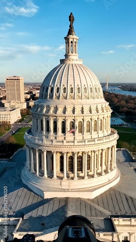 US Capitol Building Aerial View - This is an aerial view of the US Capitol Building in Washington D.C. The top of the dome, the statue, and the architecture are visible in detail.