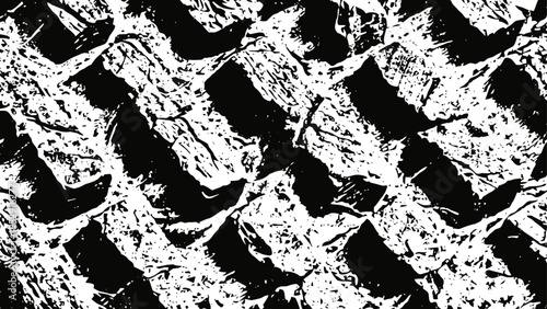 black and white close up of cracked textured surface with abstract pattern and rough edges