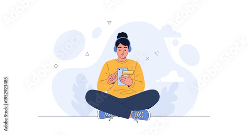 Young person listening to music on headphones while using a smartphone, sitting cross-legged