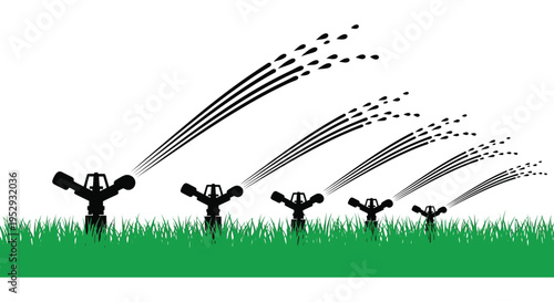 Silhouette of lawn sprinklers on green grass with water spray silhouette