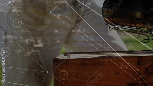 Vertical video: Beekeeper lowering smoker and opening hive, HUD overlay tracking smoke for farming