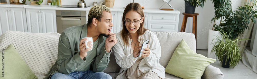 Fototapeta premium Young friends share joyful moments in a cozy apartment with a modern touch