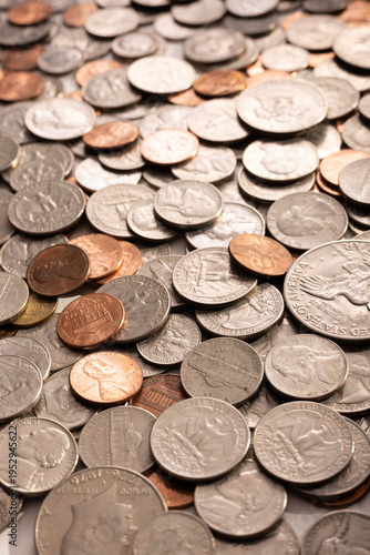 Pile of Golden coin, silver coin, copper coin, quarters, nickels, dimes, pennies, fifty cent piece and dollar coins. Various USA coins, American coins for business, money, financial coins and economy