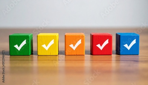 Minimalist Row of Five Vibrant Multi-Colored Wooden Blocks with White Checkmark Icons on a Natural Wood Surface Against a Neutral Gray Background