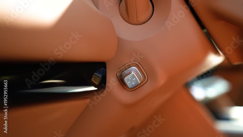 Metal steering wheel control lever in a car