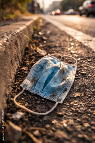 Wallpaper Mural Discarded face mask on roadside highlighting environmental issues Torontodigital.ca
