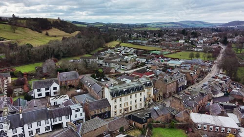 Aerial view of Melrose town in the Scottish Borders, traditional architecture and green hills landscape