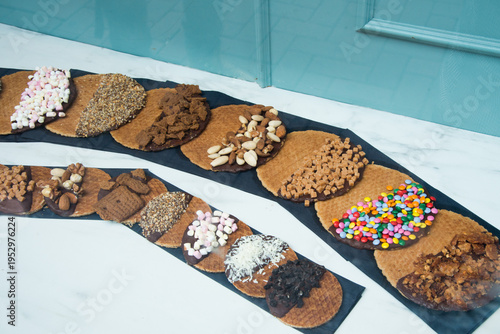 Traditional waffles with multicolored toppings to sell