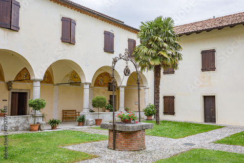 The Abbey of Rosazzo Italy - May 2021: traditional water well in the courtyard of the Abbazia di Rosazzo.