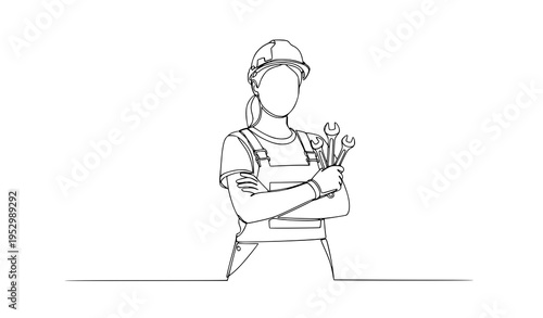 A female construction worker holding tools in a confident pose