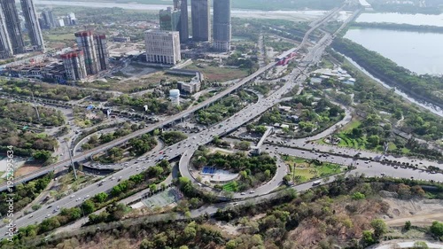 Aerial hyper lapse view of Noida Agra Highway round circle flyover at Okhla bird sanctuary in Noida, Uttar Pradesh