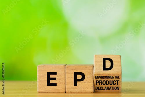 Symbol EPD, Environmental Product Declaration. Data on the products impact on the environment throughout its life cycle. Business concept written on wooden blocks. Green background. Copy space