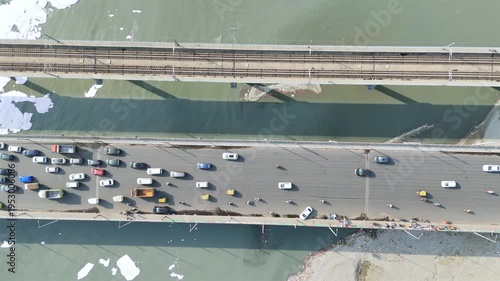 Aerial 4k view of Pollution in Yamuna River, Foam in river water and heavy traffic jam at Kalandi Kunj, Delhi, India