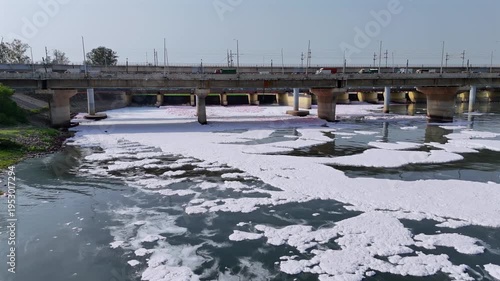 Aerial 4k view of Pollution in Yamuna River, Foam in river water at Kalandi Kunj, Delhi, India