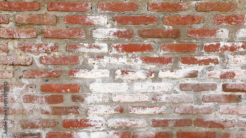 Fényképezés Red brick wall with heavy weathering and white efflorescence, textured, eroded m