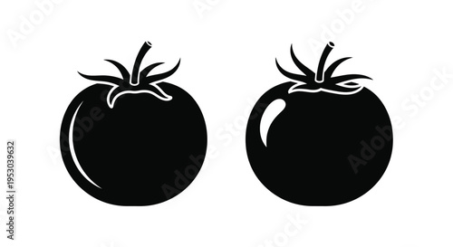 Two tomatoes in black and white one whole one with a bite taken out