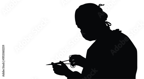 Silhouette of a surgeon in mask and cap using surgical instruments