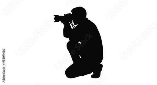 Silhouette of a man kneeling and taking a photo with a camera