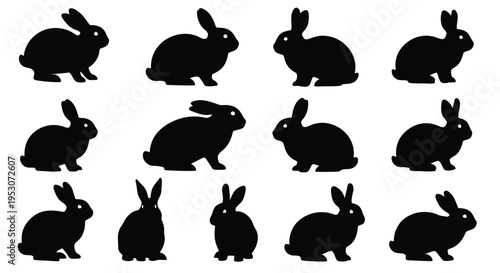 Collection of black silhouettes of rabbits in various poses and orientations
