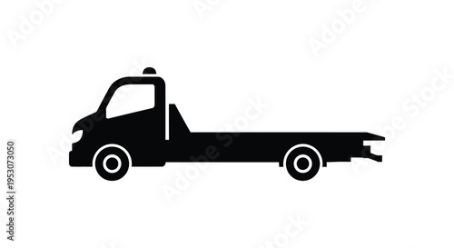 Silhouette of a flatbed tow truck vehicle in black