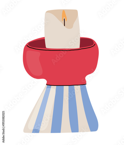Hand drawn vector illustration of a cozy burning candle in a ceramic red and blue striped candle holder. Hygge style home decor element isolated on white background.