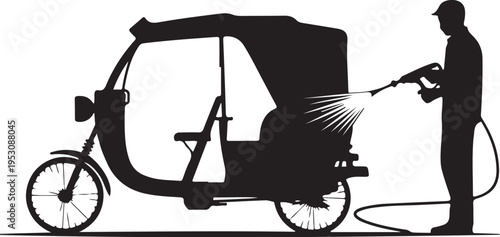 Black silhouette of man washing tuk with pressure washer