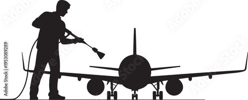 Man in silhouette washing airplane with pressure washer 1