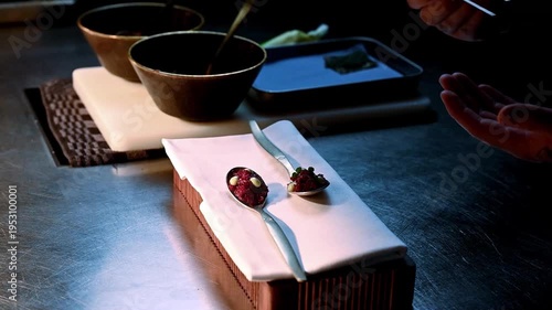 Exquisite display of tiny hors d oeuvres adorned with meticulous garnishes and gentle lighting