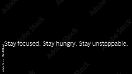 Inspirational text message advising to remain focused, stay hungry, and stay unstoppable, rendered in white typography against a solid black backdrop.