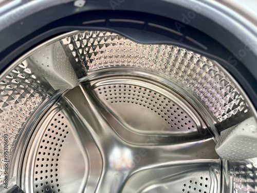 Stainless Steel Washing Drum Closeup Showing Sealing Rubber Band, Perforated Interior, Reflective Metal Surface, Radial Patterns
