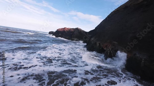 FPV Aerial of waves on the rocks