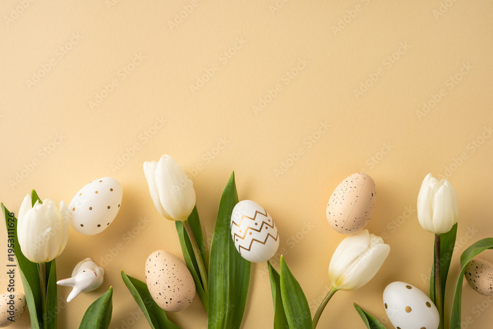 Fototapeta premium Happy Easter flat lay featuring a white tulip and decorated egg on a soft pastel background evoking spring warmth and gentle seasonal celebration