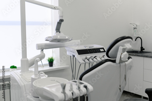 Dental clinic interior with examination chair and dental equipment visible