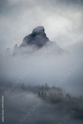 Misty Mountain Peak in Foggy Landscape