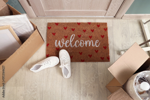 Doormat with sneakers and c...