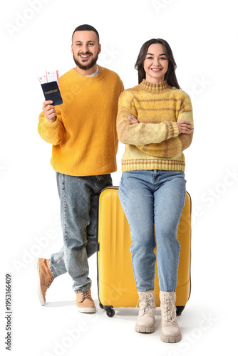 Young couple with passport and suitcase on white background. Travel concept