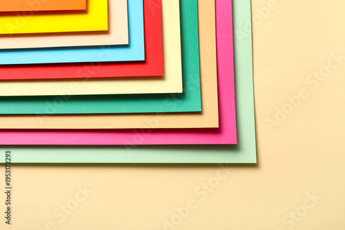 Colorful paper sheets on be...