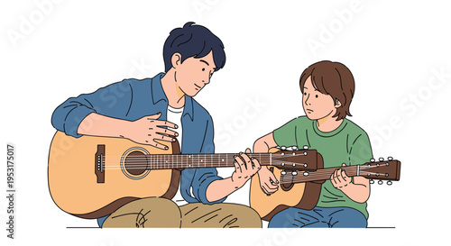 A man in a blue shirt sits cross-legged, patiently teaching a young boy in a green t-shirt how to play an acoustic guitar.